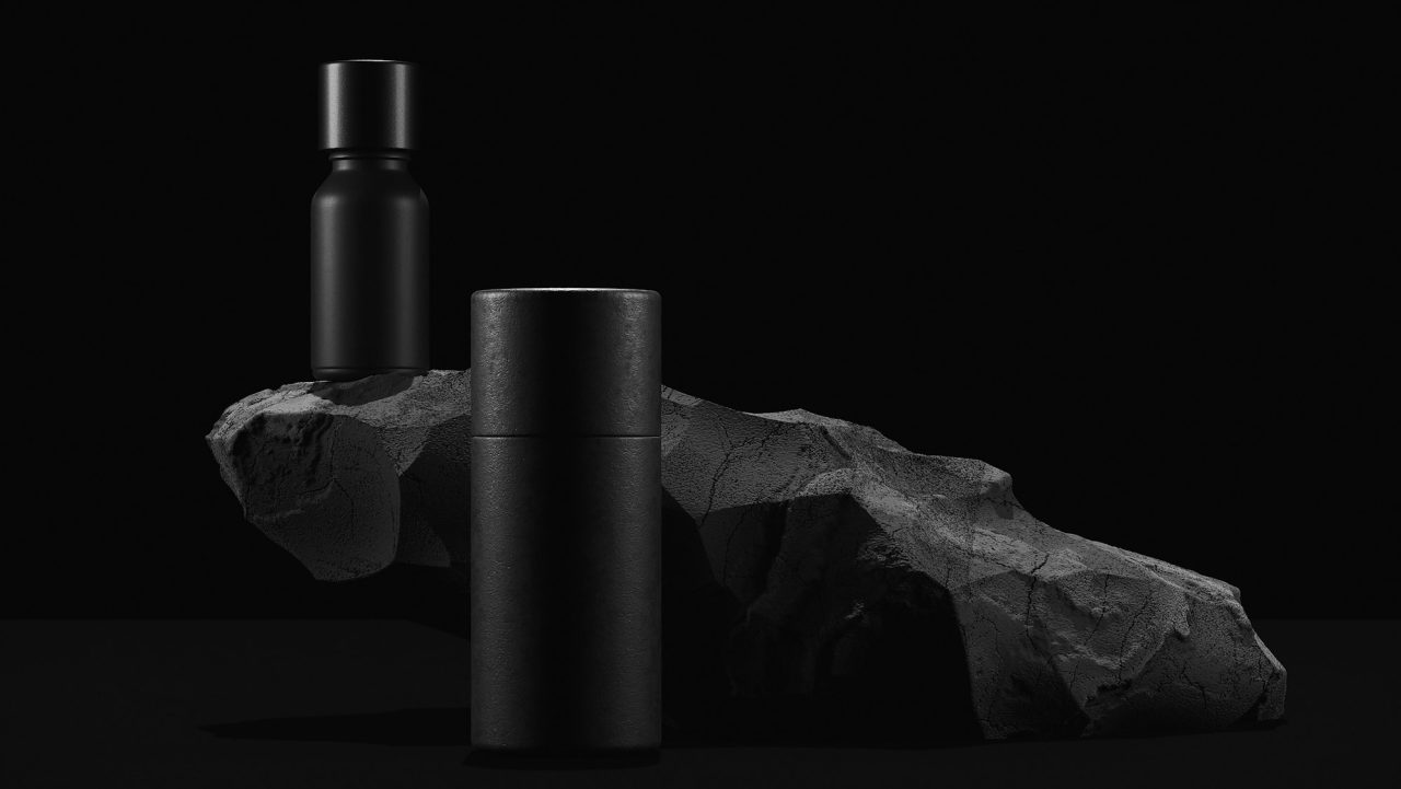 bottle of essential massage oil on stone beauty treatment minimal black design packaging mock up